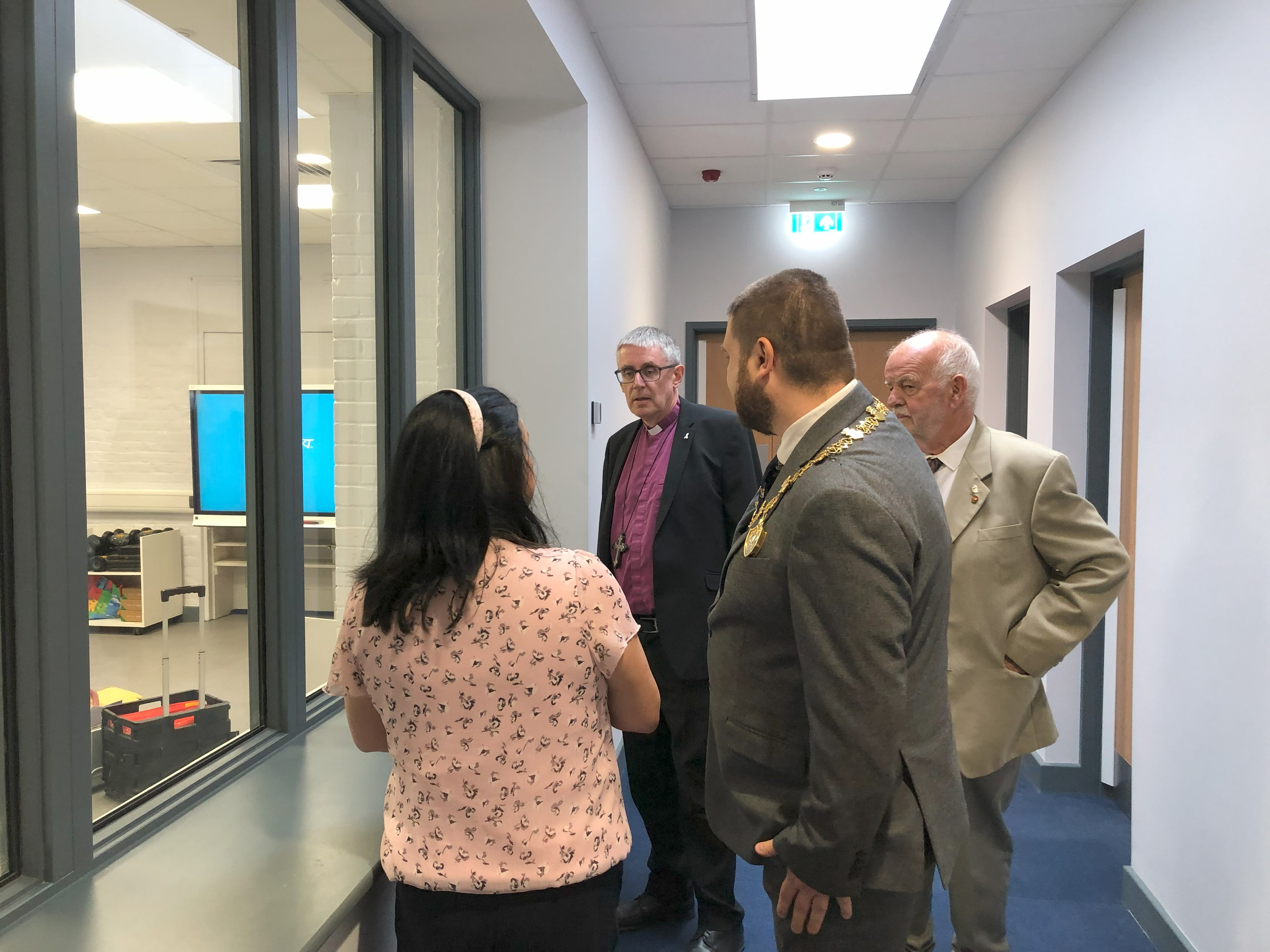 Bishop Simon and others look into one of the new teaching spaces
