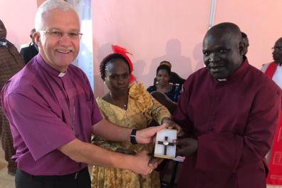 Bishop Jonathan with presents gift to new Tanzania bishop and his wife.jpg
